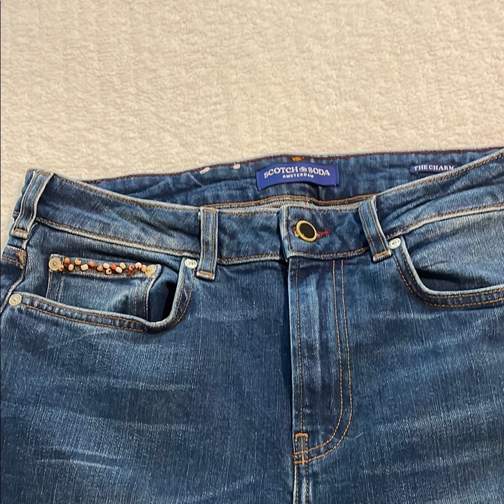 The Charm High Rise Flared womens jeans from Scotch & Soda